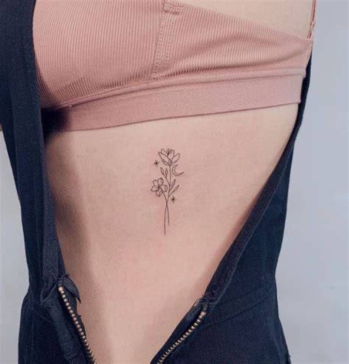Alluring Flower Rib Tattoos: Delicate Designs That Bloom On Your Body